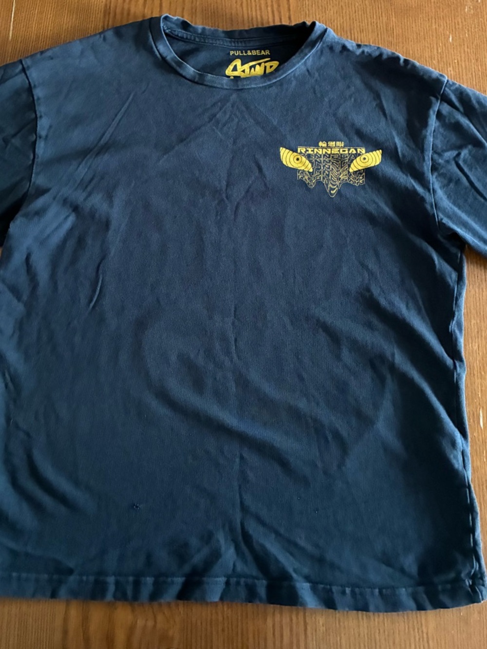 Pull&Bear Tee with Yellow Chest Emblem and Large Anime Graphic on the Back